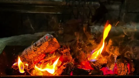 Close-up of burning wood producing a large flame. 4K Video stock 338433862