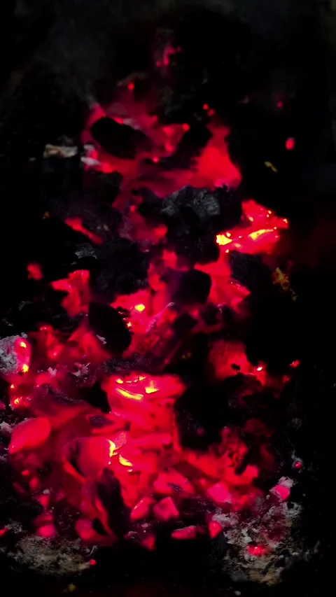 Close-up of burning wood producing a large flame. 4K Stock Footage 339044127