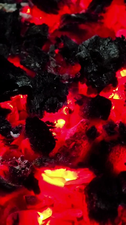 Close-up of burning wood producing a large flame. 4K Stock Footage 339044131