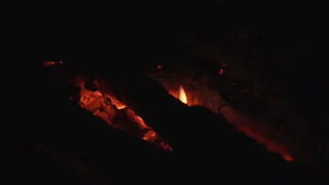 Close up of burnt down bonfire campfire with embers, flame, 4K Stock Footage 133917549