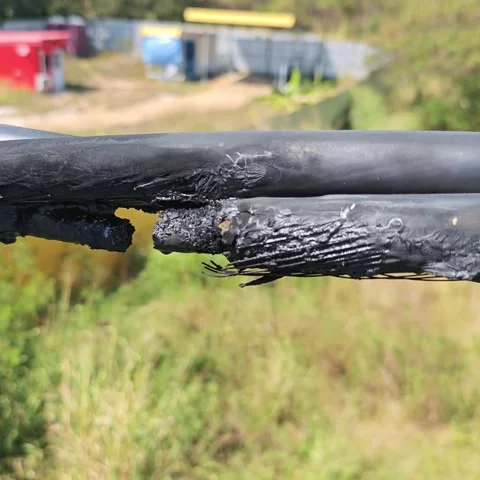 Close up of burnt high voltage electrical twisted cable insulation caused b.. Video stock 325181037