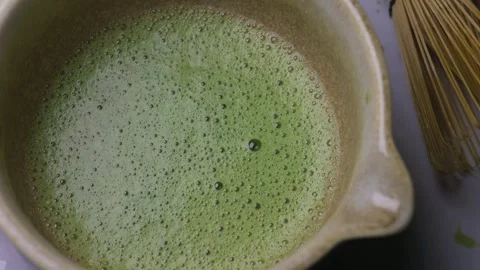 Close-Up of bursting bubbles on matcha foam. Stock Footage 329126171