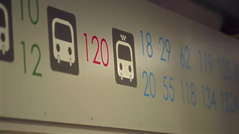 Close-up, Bus Route Numbers at Bus Stop Early Morning Stock Footage 160029096