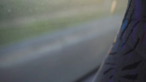 Close Up of a bus seat and a window - highway is seen in the background Stock Footage 88731015