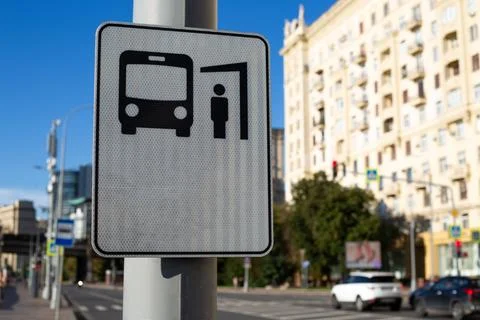 Close up of bus stop sign featuring bus and passenger icon. The sign repres.. Stock Photos