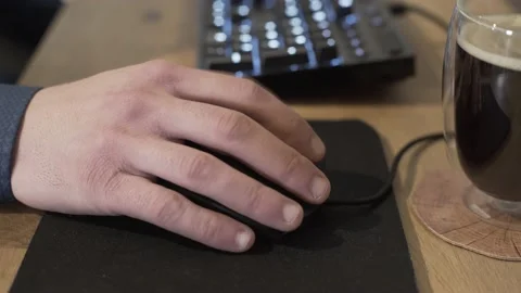 Close-up of busineman using computer mouse and clicking while working Stock Footage 133262499