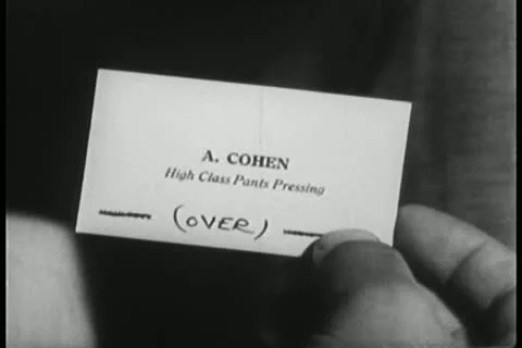 Close-up of business card with note on back Видео 11350965