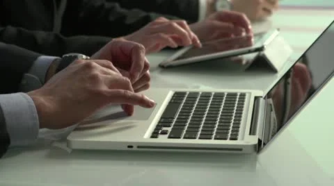 Close up of business employees' hands using laptops and tablets Stock Footage 21966531