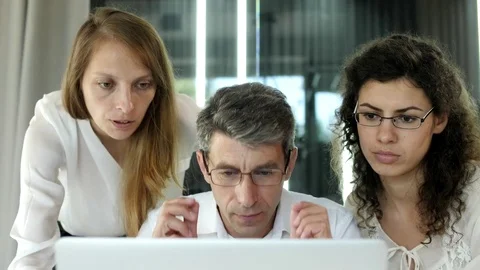 A close-up of a business group discussing a project Stock Footage 78163907