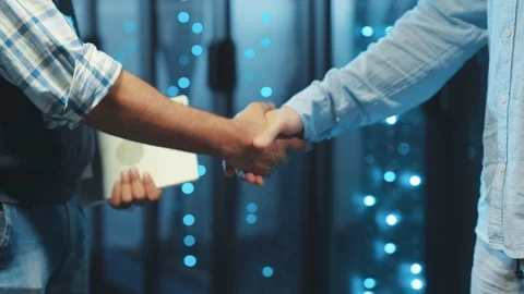 Close-up business people server engineers shaking hands of agreement welcoming Video stock 119279558