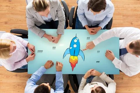 Close up of business team sitting at table Stock Illustration