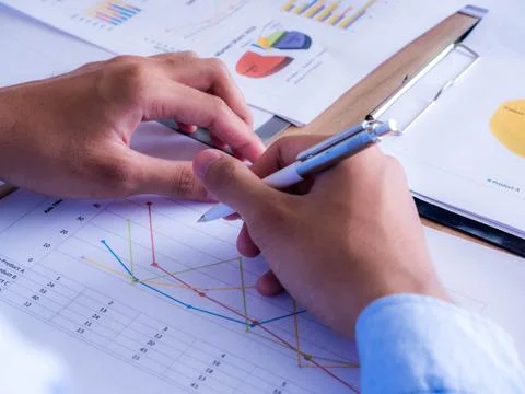 Close-up of business team using pen with financial diagram and.Growth of the Stock Photos