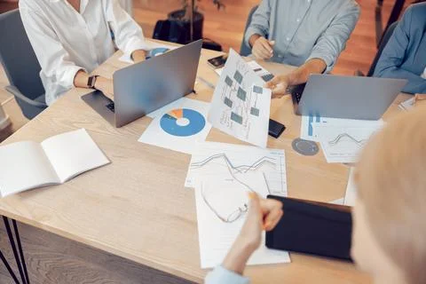 Close up of business team working with documents during meeting in office Stock Photos