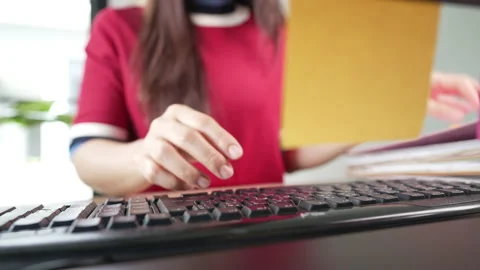 Close up A business woman's typing on computer keyboard at desk office, close Video stock 157883188