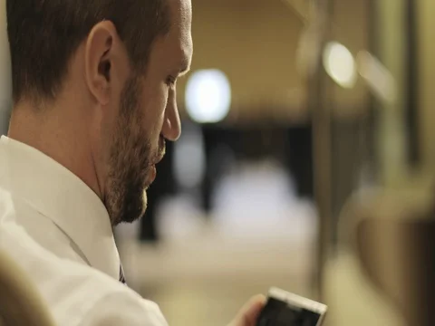Close up of businessman bearded face talking something in lobby of hotel. Stock Footage 83097522