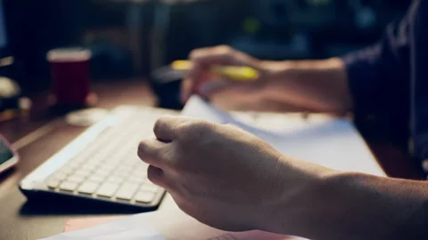 Close-up of a businessman checking financial data on clipboard documents an.. Video stock 345942094