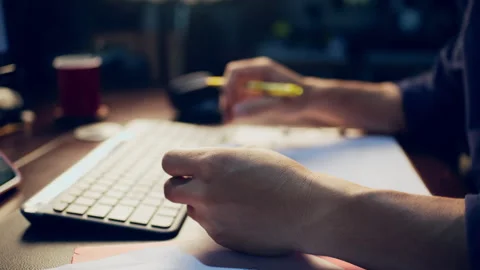 Close-up of a businessman checking financial data on clipboard documents an.. Video stock 345942160