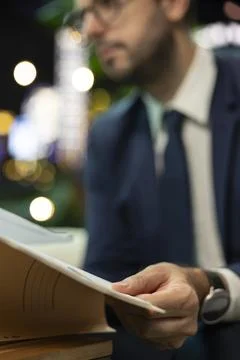 Close up of businessman checking folder with earnings report Фото