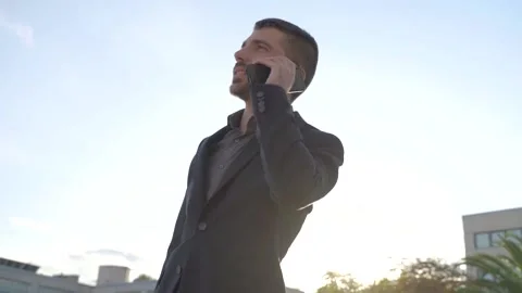 Close up of businessman in classic suit is using smartphone outdoors Video stock 141916137
