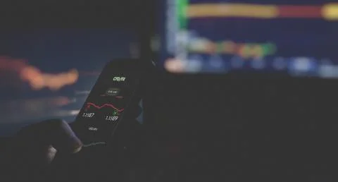 Close up of businessman in dark using mobile smart phone. Foto stock