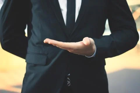 Close up.businessman with empty hand on blurred background Stock Photos