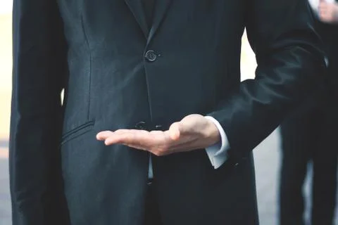 Close up.businessman with empty hand on blurred background Stock Photos