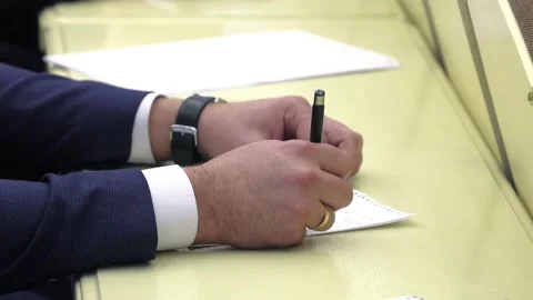 Close-up of businessman hand with pen explaining Stock Footage 300760796