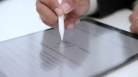 Close up businessman hand working electronic Signature on Tablet by Stylus. Stock Footage 169200860