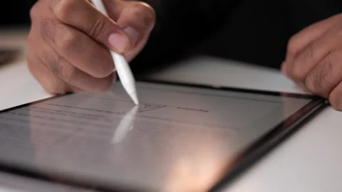 Close up businessman hand working electronic Signature on Tablet by Stylus. Stock Footage 169201526