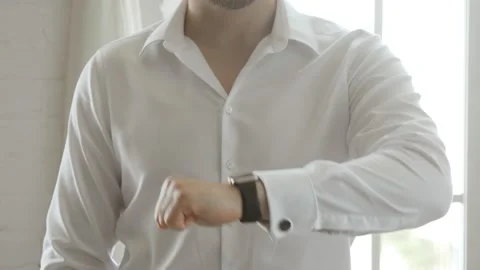 Close up of businessman hands checking life datas on smart watch with hologram. Stock Footage 133676201