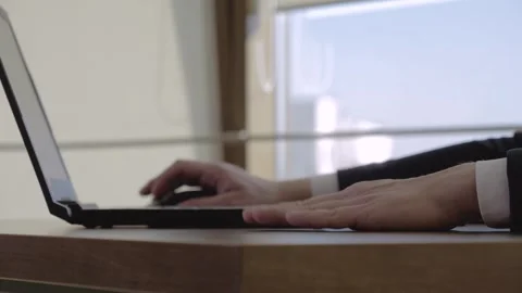 Close up businessman hands knocking on the table near laptop keyboard Video stock 306239218