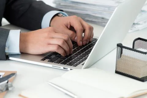 Close-up of businessman hands working on computer Stock Photos