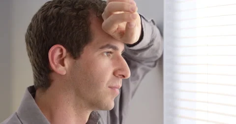 Close up of businessman looking out window Video stock 42587026