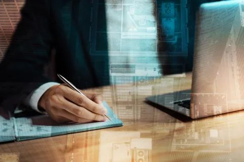 Close up of businessman making notes in his notebook Stock Photos