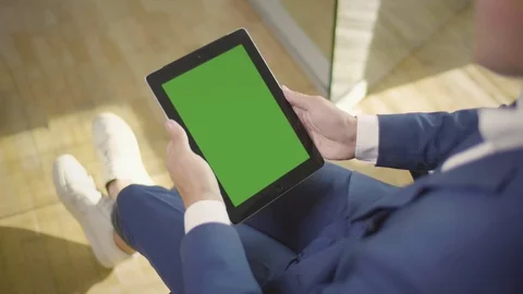 Close up of businessman reading an article on a tablet Stock Footage 95689598