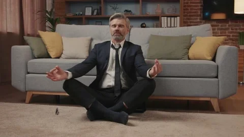 Close up businessman in suit break sit at home near couch on floor meditating Vídeos de archivo 220200959