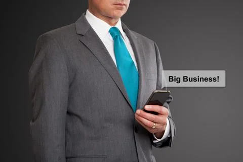 Close up of businessman text messaging on cell phone Stock Photos