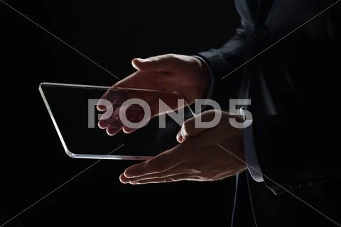Close up of businessman with transparent tablet pc Stock Photos