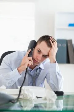 Close up of businessman trying to solve a problem on the phone Foto stock
