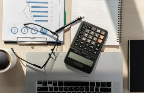 Close up businessman using calculator on documents Unrecognizable finance  us Stock Photos
