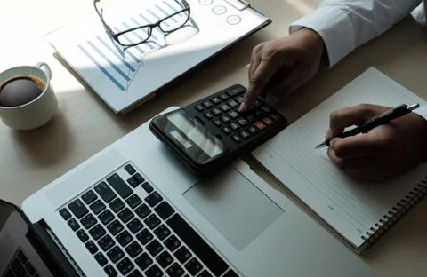 Close up businessman using calculator on documents Unrecognizable finance  us Foto stock