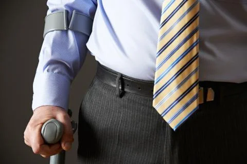 Close Up Of Businessman Using Crutch Stock Photos