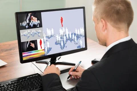 Close-up Of A Businessman Using Graphic Tablet For Digital Printing. Source o Stock Photos