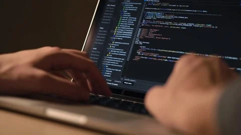 Close-up of a businessman using laptop coding HTML programming with laptop Stock Footage 334586636