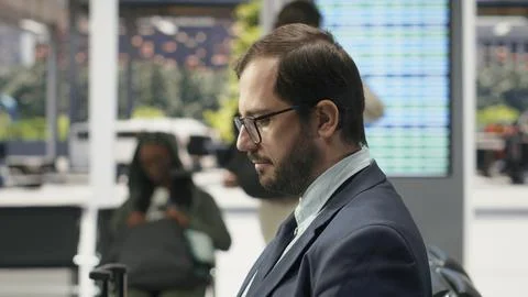 Close up of businessman using mobile phone in bus station Stock Photos