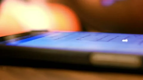 Close up of a businessman using mobile smart phone in cafe. Macro with blurred Stock-Footage 44228742