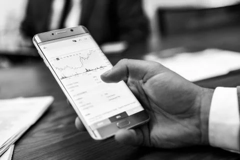 Close up of businessman using mobile smart phone. Stock Photos