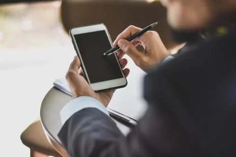 Close up businessman using mobile smart phone business communication technolo Stock Photos