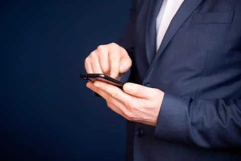 Close up of a businessman using mobile smart phone Foto stock