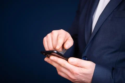 Close up of a businessman using mobile smart phone Stock Photos